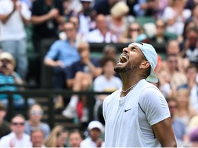 Australia's Nick Kyrgios celebrates winning against US Brandon Nakashima at the end of their round of 16 men's singles tennis match on the eighth day of the 2022 Wimbledon Championships at The All England Tennis Club in Wimbledon, southwest London, on July 4, 2022.