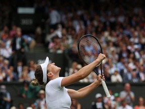 Romania's Simona Halep celebrates winning against US player Amanda Anisimova during their women's singles quarter final tennis match on the tenth day of the 2022 Wimbledon Championships at The All England Tennis Club in Wimbledon, southwest London, on July 6, 2022.