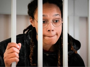 US WNBA basketball superstar Brittney Griner reacts inside a defendants' cage before a hearing at the Khimki Court, outside Moscow on July 26, 2022.