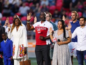 25 of Canada's newest citizens are sworn in at special citizenship ceremony hosted by the Ottawa RedBlacks during half-time of their game against the Montreal Allouettes.
