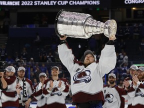 Avalanche goaltender Darcy Kuemper (35) celebrates with the Stanley Cup after the Avalanche game against the Tampa Bay Lightning in game six of the 2022 Stanley Cup Final at Amalie Arena.