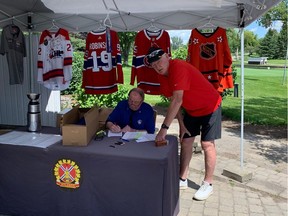 OTTAWA — Aug.  5, 2022 — Larry Robinson checking in at the Ottawa Valley Hockey Oldtimers 50th anniversary tournament.  Photo: Ken Warren/Postmedia