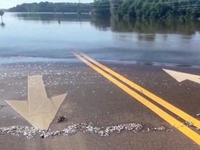 A flooded road is seen near Pearl River following water discharges from Barnett Reservoir over the weekend, in Ridgeland, Mississippi, in this screen grab taken from a video Monday, Aug. 29, 2022.