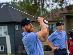 With partner Jack Quinn watching, Claude Giroux takes a shot during Round 1 of the Ottawa Sun Scramble's GolfWorks A Division at eQuinelle Golf Club on Aug. 23, 2022.