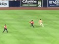 An underwear-wearing streaker is chased by security during a Padres game against the Twins in San Diego on Saturday, July 30, 2022.