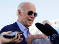 U.S. President Joe Biden talks to reporters while boarding Air Force One on travel to Eastern Kentucky to visit families affected by devastation from recent flooding, as he departs from Delaware Air National Guard Base in New Castle, Del., Aug. 8, 2022.