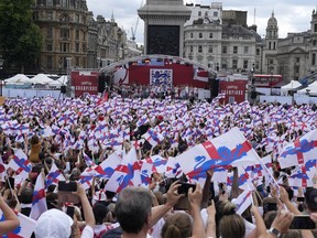 England players celebrate on stage at an event at Trafalgar Square in London, Monday, Aug. 1, 2022. England beat Germany 2-1 and won the final of the Women's Euro 2022 on Sunday.