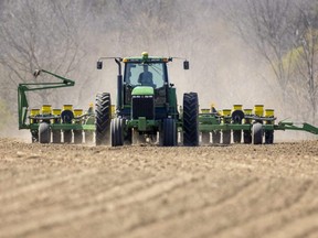 Jordan Fleming, a Delaware, Ont., area farmer, starts to get his corn in on a rented field east of Komoka, May 8, 2022.