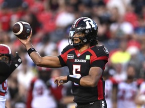 Ottawa Redblacks quarterback Caleb Evans (5) throws the ball during first half CFL football action against the Calgary Stampeders in Ottawa on Friday, Aug. 5, 2022.