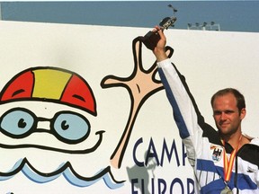 FILE - German gold medalist in the 10 meter diving competition Jan Hempel, poses with his trophy on Aug. 18, 1997 in the European Swimming Championships in Seville, Spain. Former Olympic diver Jan Hempel has accused the German swimming federation of failing to heed his complaints of his years-long sexual abuse by former coach Werner Langer. "The federation (DSV) suggested to me that if I spread that around, it would put our sport in danger and then you can't take part in your sport anymore. Of course, I was at a level where I had goals in mind and I wanted to reach them," Hempel told news agency DPA on Friday, Aug. 19, 2022.