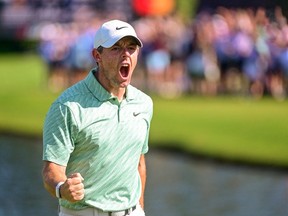 Aug 28, 2022; Atlanta, Georgia, USA; Rory McIlroy reacts after making a birdie putt on the 15th hole during the final round of the TOUR Championship golf tournament.