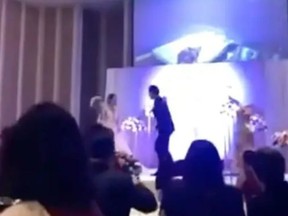 Screen shot of TikTok video that shows groom outing bride's affair during wedding reception.