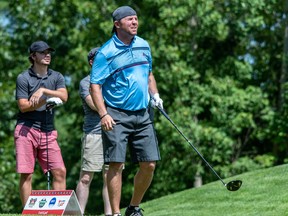 Martin Herde, who teamed up with Geoffrey Frigon to shoot a Round 1 score of 8-under to take the lead the GolfTEC B Division, watches a tee shot Wednesday at Le Sorcier.