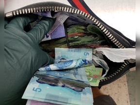Ottawa police arrested three people and seized $15,000 in cash and a quantity of drugs after car chase with a vehicle that refused to stop, then hit a police vehicle Monday.