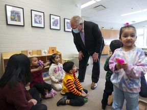 Ontario Premier Doug Ford, centre, visits a daycare centre after reaching and agreement with the federal government in $10-a-day child-care program deal in Brampton, Ont., on Monday, March 28, 2022.