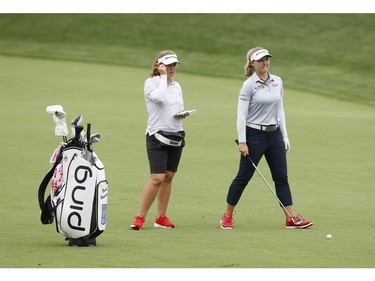 Brooke Henderson and her caddie/sister Brittany are seen during a practice round at the CP Women's Open at the Ottawa Hunt and Golf Club on Tuesday.