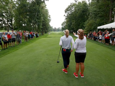 Brooke Henderson and her caddie/sister Brittany are seen during a practice round at the CP Women's Open at the Ottawa Hunt and Golf Club on Tuesday.