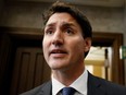 Prime Minister Justin Trudeau speaks to journalists before Question Period in the House of Commons foyer on Parliament Hill in Ottawa, Sept. 22, 2022.