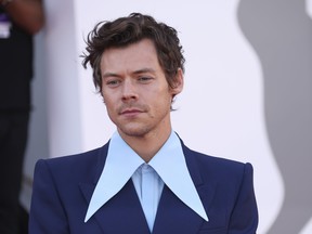 Harry Styles poses for photographers upon arrival at the premiere of the film 'Don't Worry Darling' during the 79th edition of the Venice Film Festival in Venice, Italy, Monday, Sept. 5, 2022.