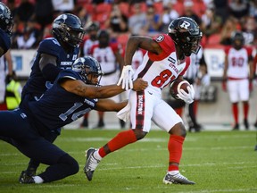 Ottawa Redblacks wide receiver Terry Williams (81) is defended by Toronto Argonauts kicker Boris Bede (14) while returning the ball during second quarter CFL action, in Toronto on Sunday July, 31, 2022.