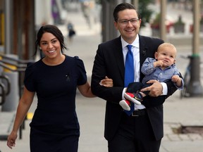 Conservative party leader Pierre Poilievre, wife Anaida and son Cruz arrive at the National Conservative caucus meeting on Sept. 12, 2022 in Ottawa.