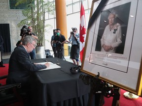 Ottawa Mayor Jim Watson is the first to sign a book of condolences to honour the passing of Queen Elizabeth II at City Hall.