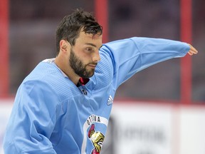 Derick Brassard changes into a blue "non contact" jersey at Senators practice in 2017.