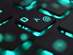 In this file photo taken on June 25, 2019 this illustration picture taken in Brest, France, shows a close-up view of a computer keyboard.