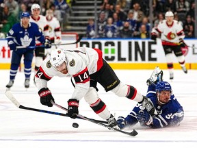 Ottawa Senators forward Tyler Motte (14) breaks away from Toronto Maple Leafs forward Auston Matthews (34) before scoring during the third period at Scotiabank Arena.