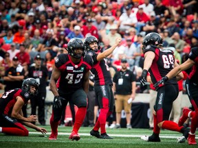A 2019 file photo of the Redblacks' Lewis Ward attempting a field goal in a CFL game against the Tiger-Cats.