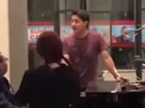 A short video posted to YouTube shows Prime Minister Justin Trudeau singing in the lobby of a U.K. hotel on Saturday during the mourning period for the Queen.