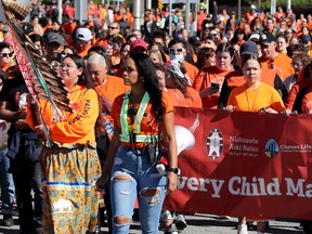 Marchers stream from Parliament Hill to LeBreton Flats for the National Day of Truth and Reconciliation event on Friday.