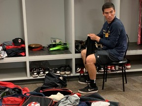 Ottawa Titans catcher Tyrus Greene packs up his belongings Monday after the club lost Frontier League East Division final to Quebec Capitales on Sunday.