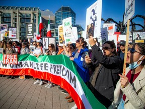 Saturday's protest started at the National Gallery of Canada and marched to form a human chain stretching the length of the Alexandra bridge. This was the sixth local protest that all began in response to the death of Mahsa "Gina" Amini, a Kurdish-Iranian woman who had been detained by the "morality police" for failing to adhere to strict hijab requirements.