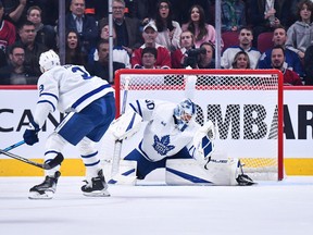 Goalie Matt Murray makes a glove save during the Maple Leafs' season opener against the Canadiens in Montreal on Wednesday night.
