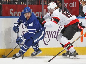 Jake Sanderson #85 of the Ottawa Senators skates to check John Tavares #91 of the Toronto Maple Leafs during the first period of their NHL game at Scotiabank Arena on Oct. 15, 2022 in Toronto.