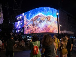 A general view of the broadcast of NASA's first images from James Webb Space Telescope to screens in Picadilly Circus on July 12, 2022 in London.