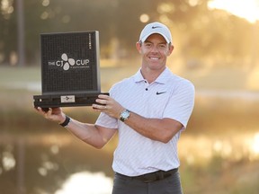 Rory McIlroy of Northern Ireland celebrates with the trophy after winning during the final round of the CJ Cup at Congaree Golf Club on October 23, 2022 in Ridgeland, South Carolina.