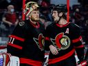 Thomas Chabot, seen with goaltender Anton Forsberg, says now it's about going to work as the regular season begins. 