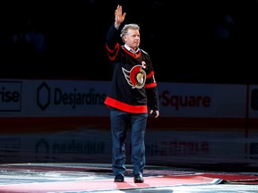 Ottawa Senators legend Daniel Alfredsson acknowledges the crowd as he takes the ice to drop the puck for a ceremonial face-off for the Sens home opener on October 18,2022.