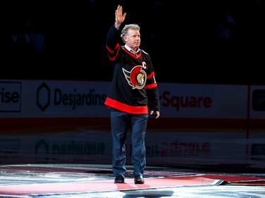 Ottawa Senators legend Daniel Alfredsson acknowledges the crowd as he takes the ice to drop the puck for a ceremonial faceoff for the Sens' home opener on Oct. 18, 2022.