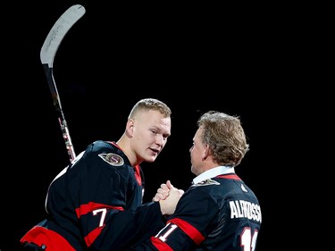 Ottawa Senators legend Daniel Alfredsson shakes hands with captain Brady Tkachuk after he dropped the the puck for a ceremonial faceoff for the Sens' home opener against the Boston Bruins on Oct. 18,2022.