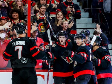 Ottawa Senators left wing Brady Tkachuk (7) celebrates a goal with teammates Drake Batherson (19) and tim Stützle (18) during first period NHL action at Canadian Tire Centre on Oct. 18, 2022.