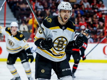 Boston Bruins left wing A.J. Greer (10) celebrates his goal against the Ottawa Senators during second period NHL action at Canadian Tire Centre on Oct. 18, 2022.  ERROL MCGIHON/Postmedia