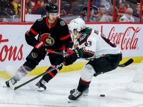 Ottawa Senators centre Josh Norris (9) moves the puck around Arizona Coyotes left wing Matias Maccelli (63) during third period NHL action at the Canadian Tire Centre on Oct. 22, 2022.