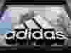 In this file photo taken March 29, 2020, The logo of German sporting goods company Adidas is pictured at one of the company's outlets in Berlin.