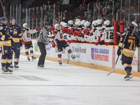 67’s forward Brady Stonehouse celebrates at the bench after scoring Ottawa’s first goal of the game during their home opener against the Erie Otters on Sunday at TD Place.