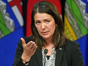 Danielle Smith speaks to media after being sworn in as Alberta’s new premier in Edmonton on Oct. 11, 2022.
