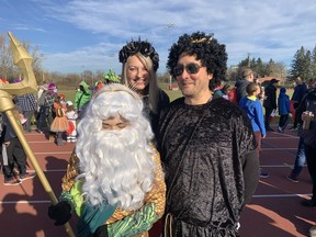 Katie, Kristine and Chris Lee joined Ausome Ottawa's Halloween "Trot or Treat" day to raise money for sports programs for children with autism. Katie dressed as Posiedon because she likes Greek mythology.