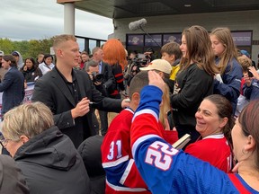 Senators captain Brady Tkachuk signs autographs in Bouctouche, N.B. before Saturday’s NHL preseason game against the Canadiens.